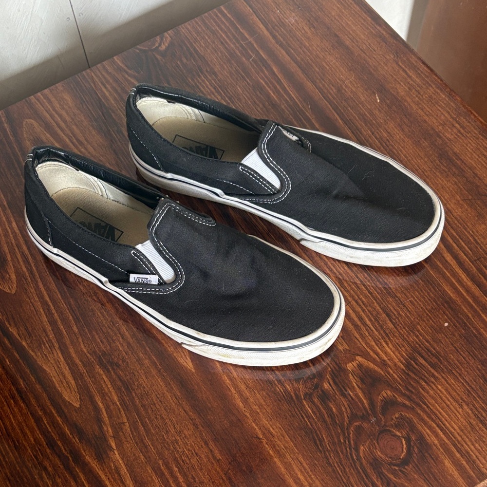 Vans Black and White Slip-On Sneakers